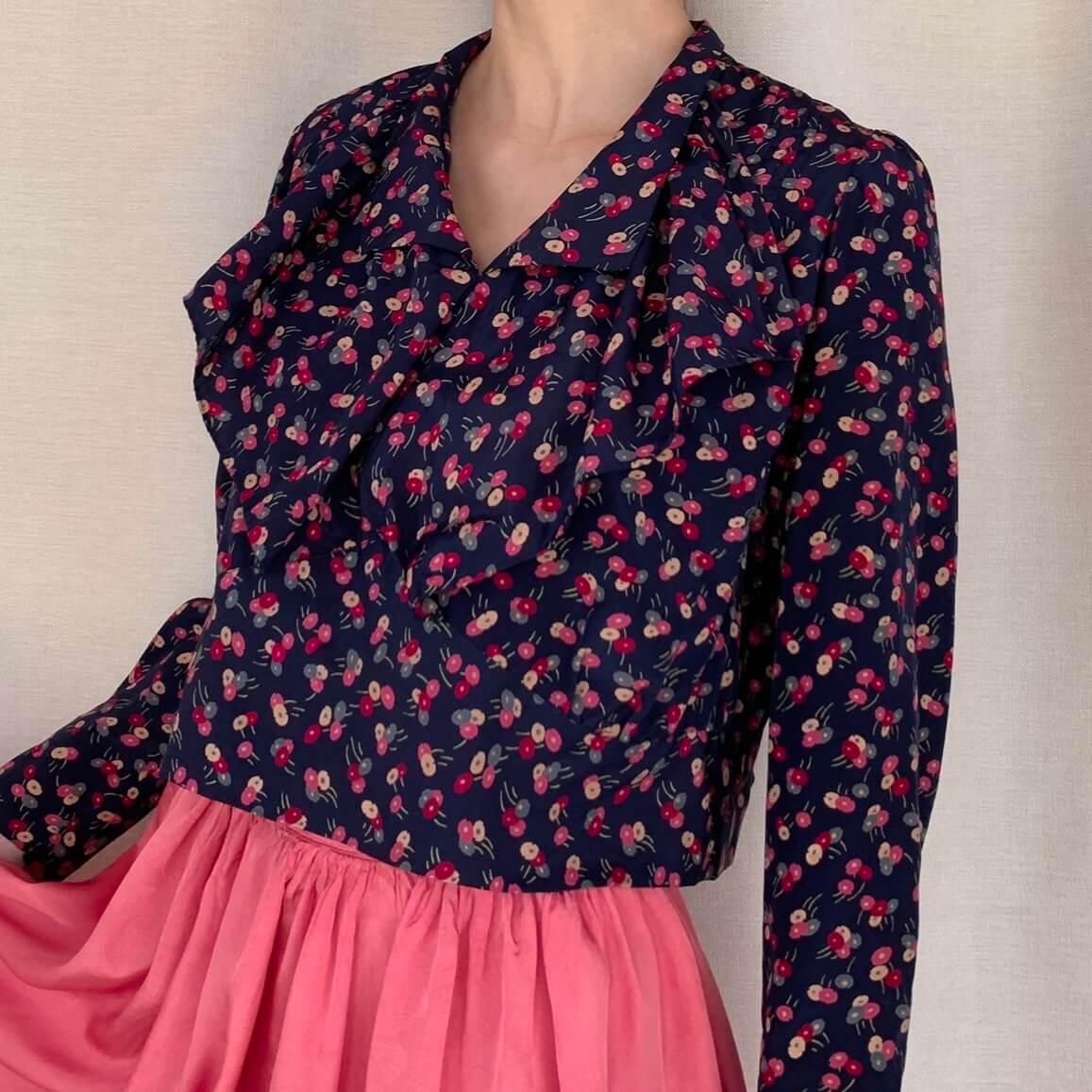 1920s printed silk blouse in a blue and pink floral pattern with a ruffle collar