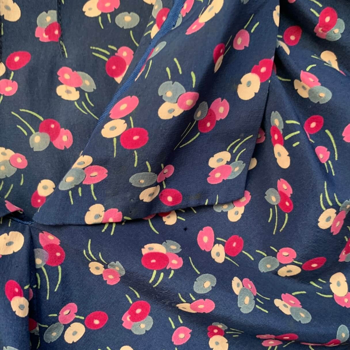close up of navy and pink flower printed fabric