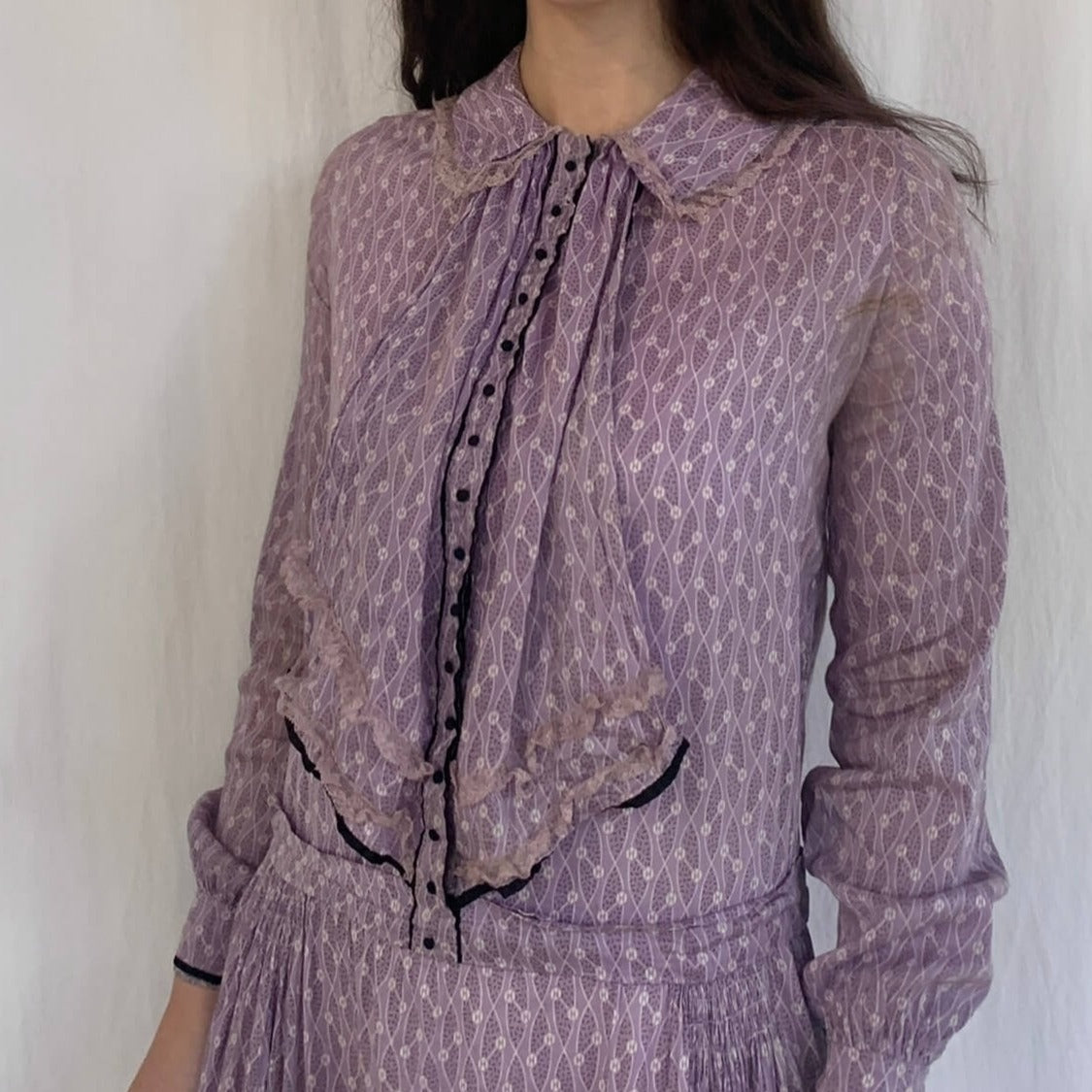 model wearing a vintage purple print dress