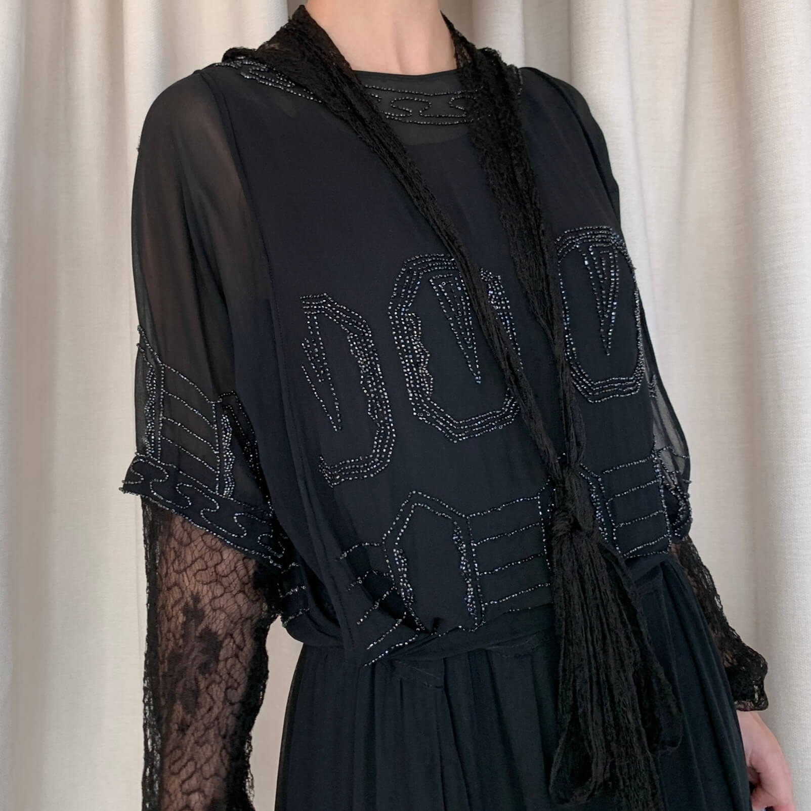 1920s beaded gown detail with black glass beads on silk chiffon