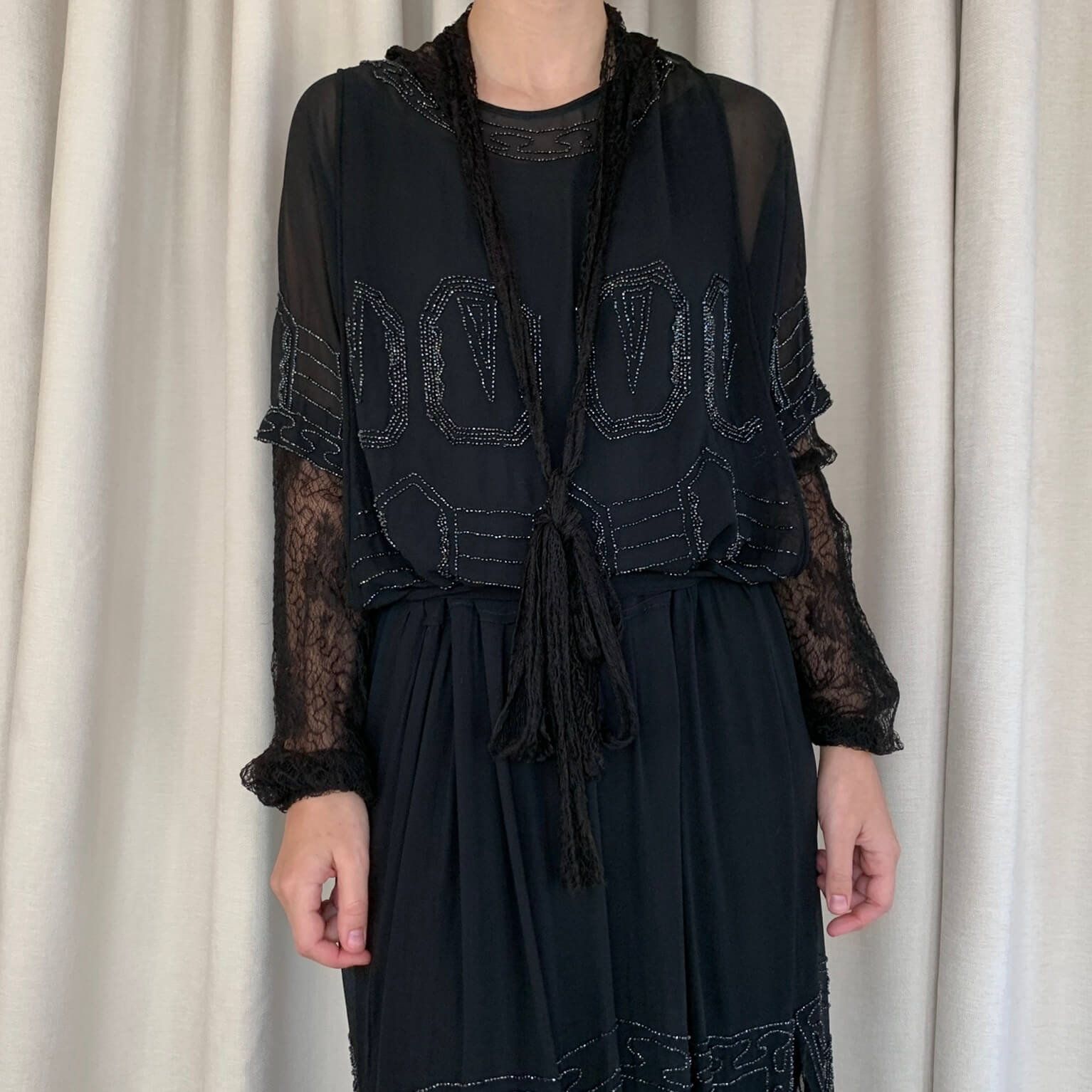 Black Art deco dress on a model