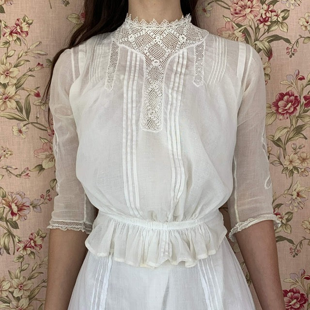 white voile cotton lace blouse from the 1900s on a model