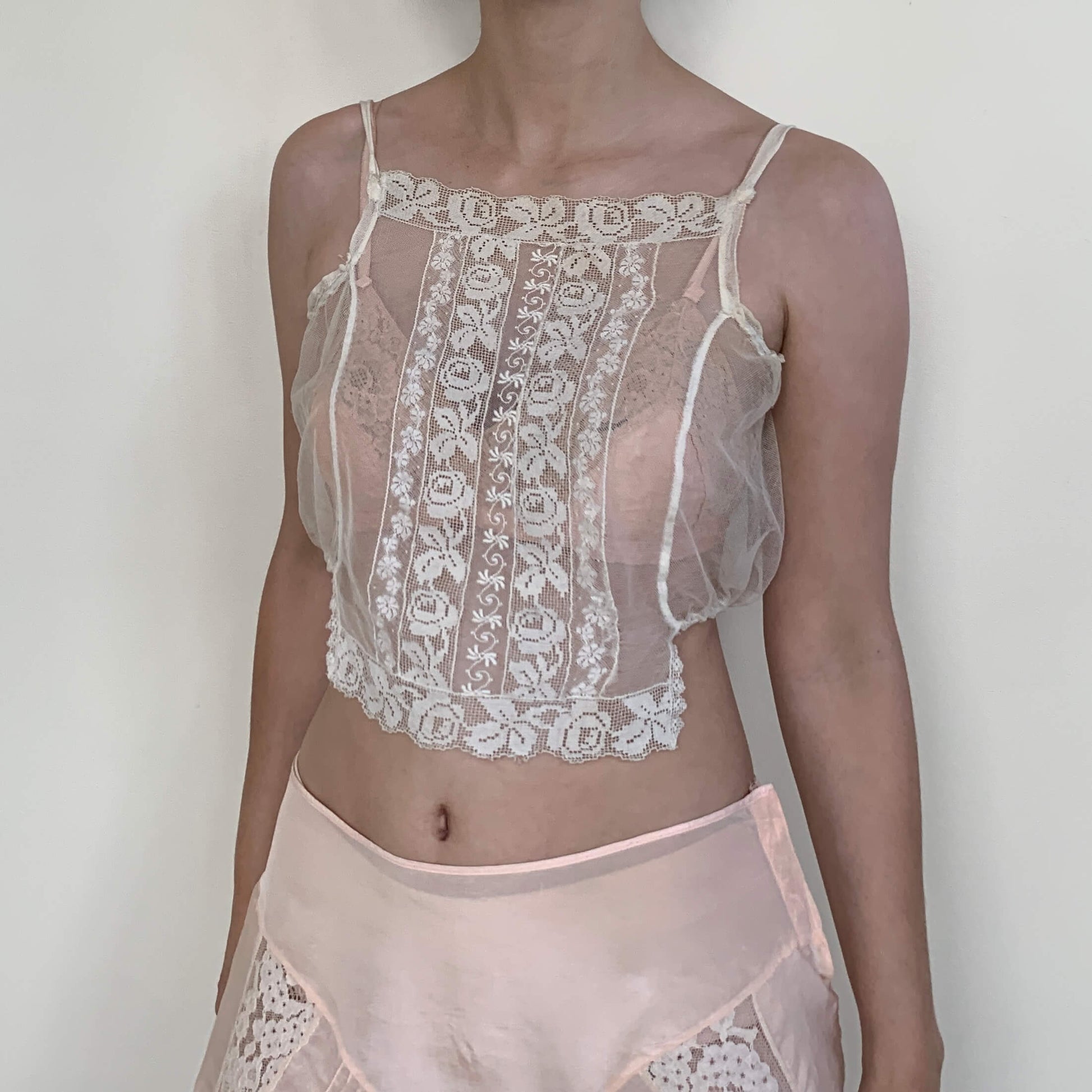 sheer camisole made of floral lace on model