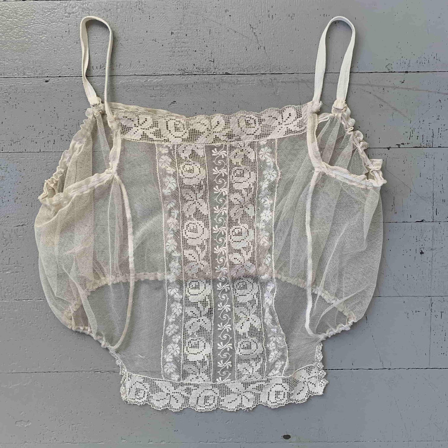 flat view of the antique lingerie top