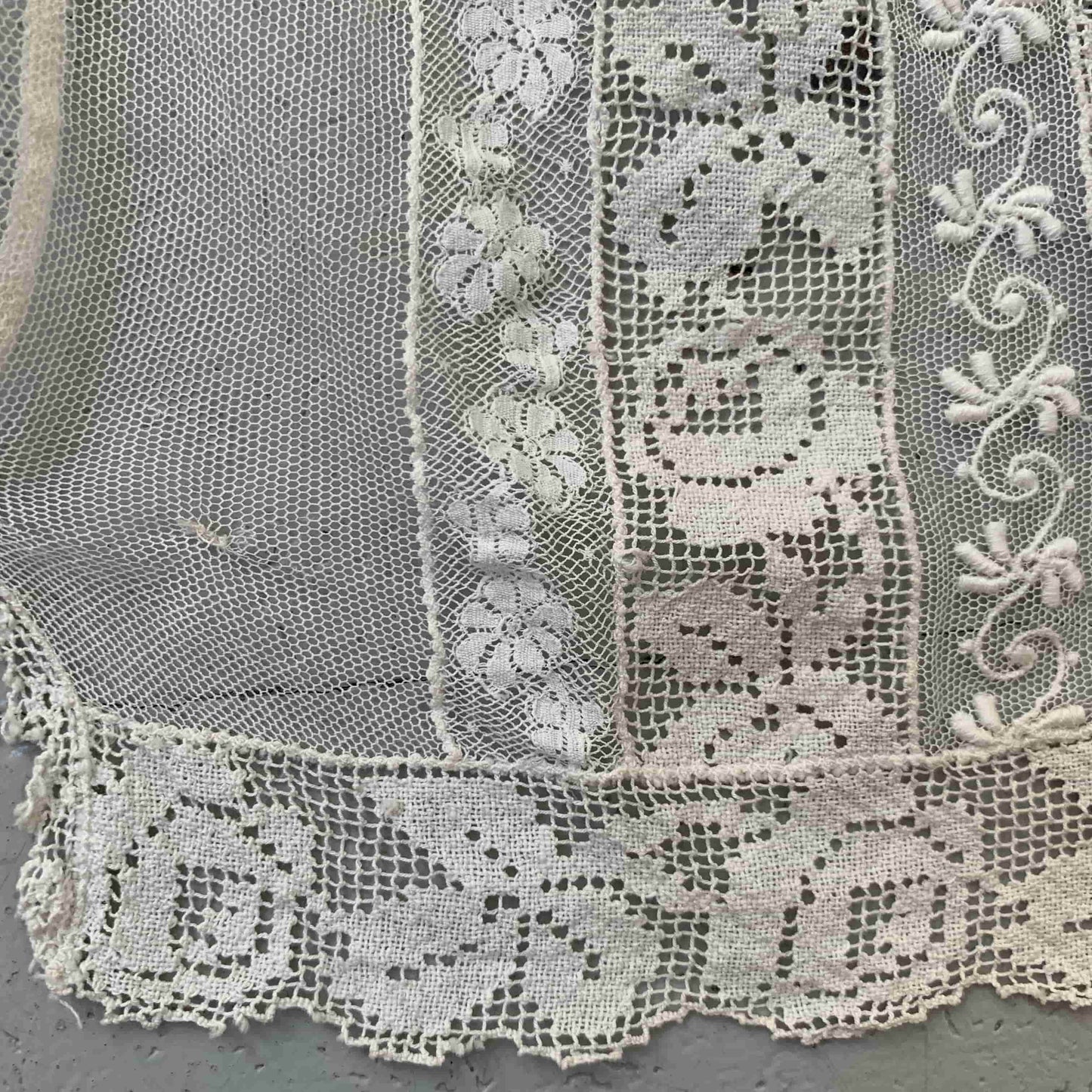close up detail of the floral filet lace