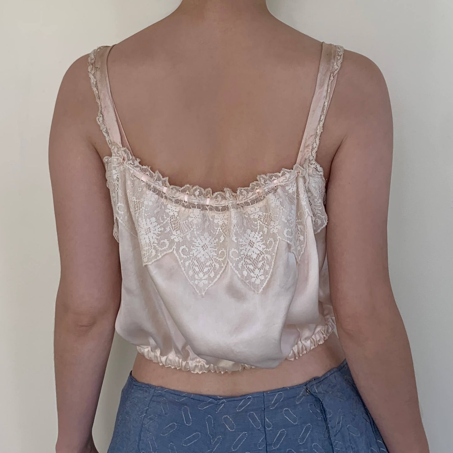 Back view of pink silk Edwardian corset cover on model