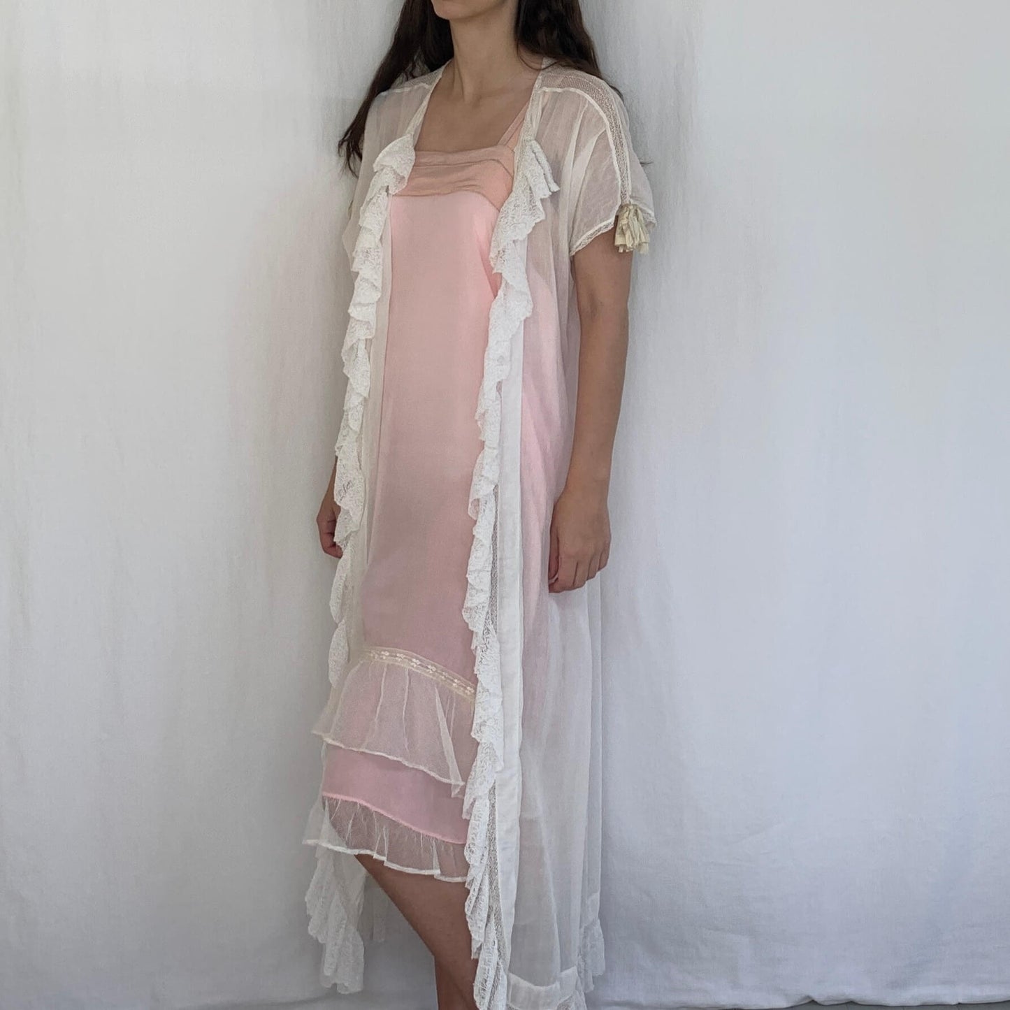 sheer white cotton edwardian nightgown on model wearing pink dress