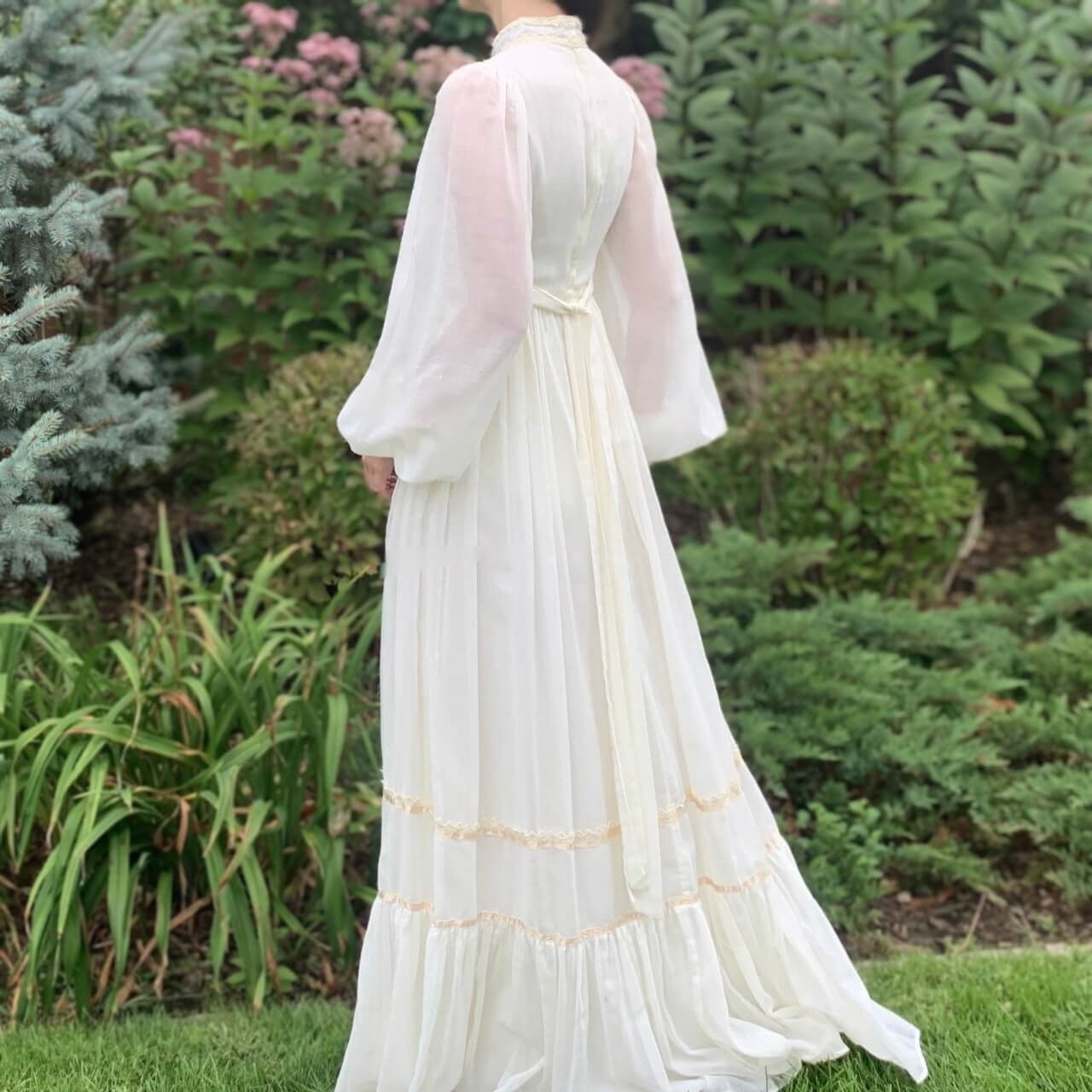 back view of a 70s wedding dress with bishop sleeves