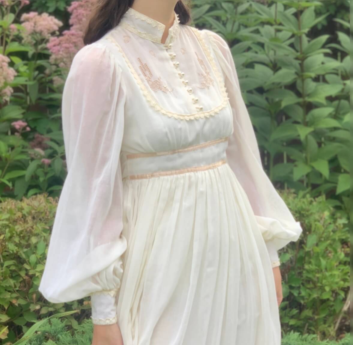 model wearing a white vintage wedding dress