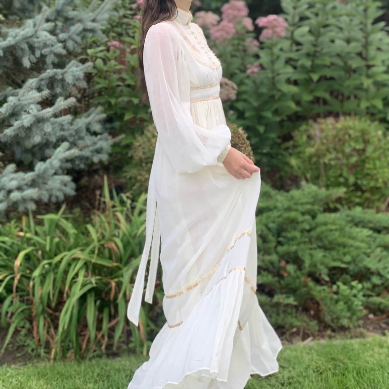 model wearing a white maxi dress outside
