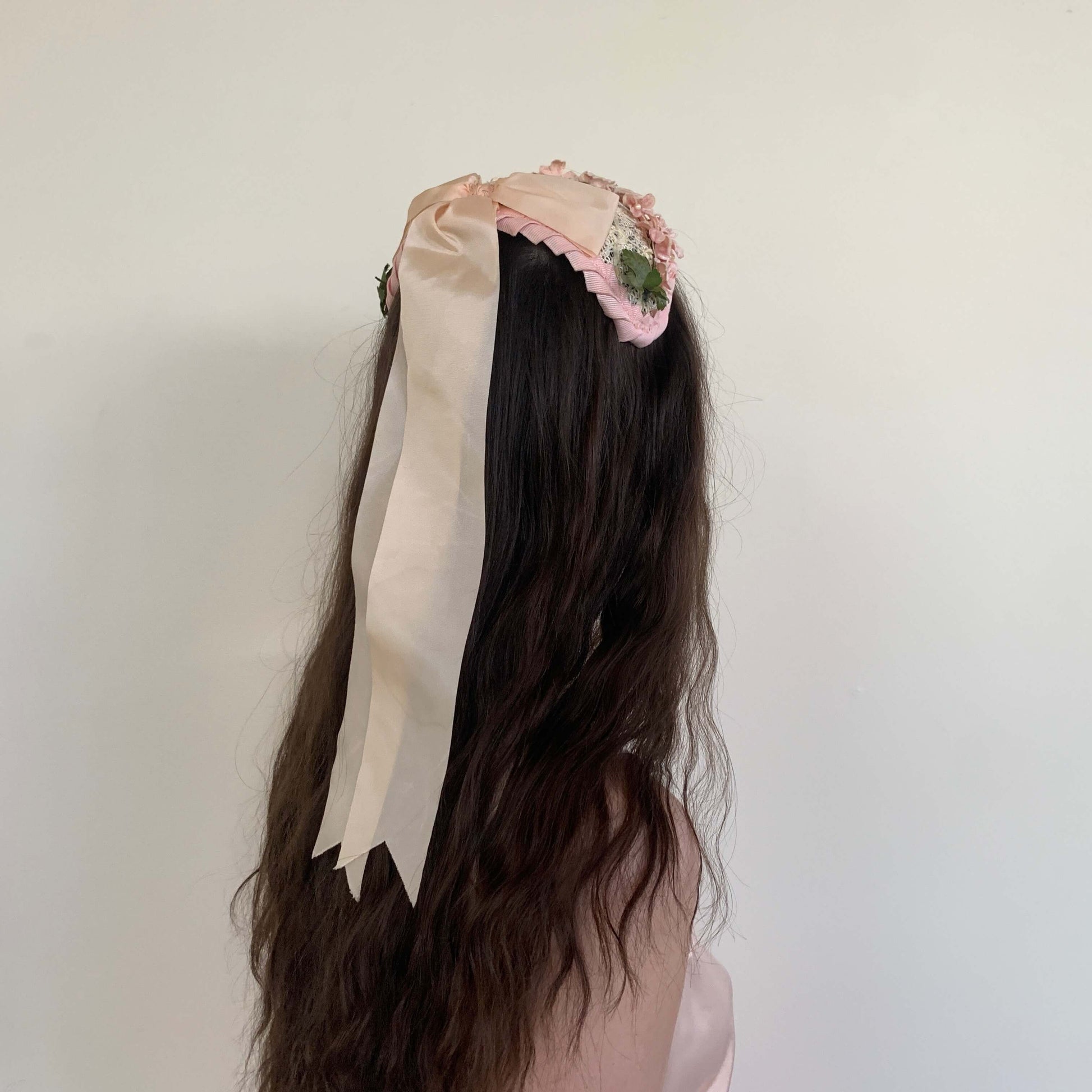 1950s pink easter bonnet view from the back with the long ribbon