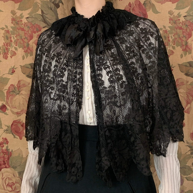 The black lace capelet shown from a different angle