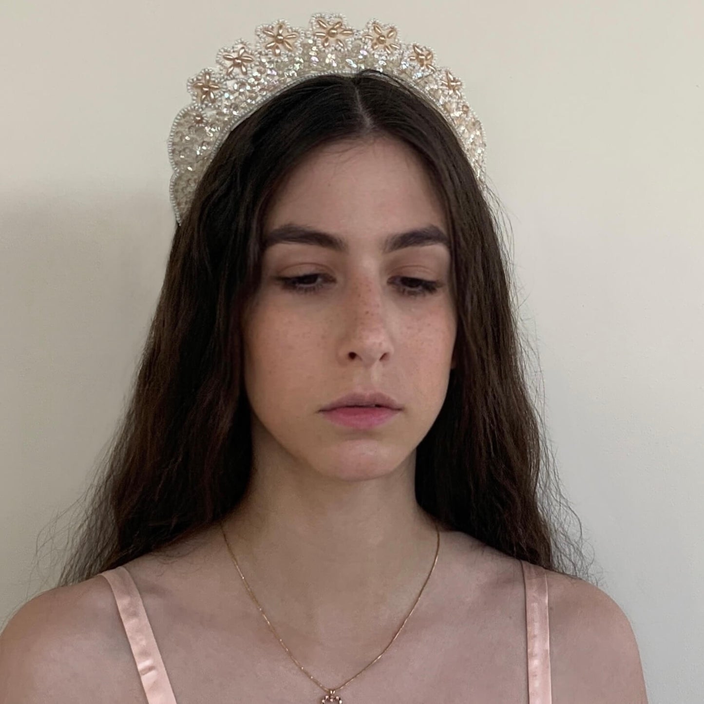 Vintage pearl crown from the 1930s with ivory beads and sequins on a bridal model