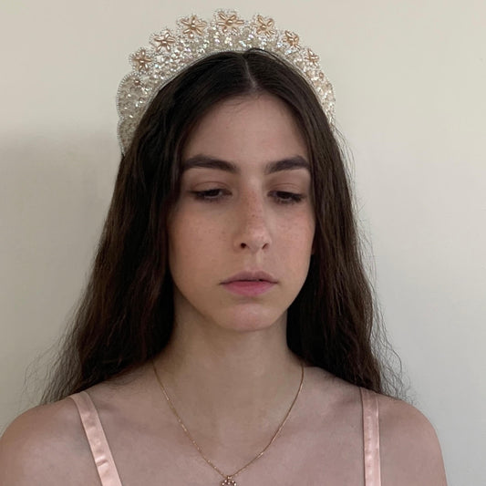 Vintage pearl crown from the 1930s with ivory beads and sequins on a bridal model
