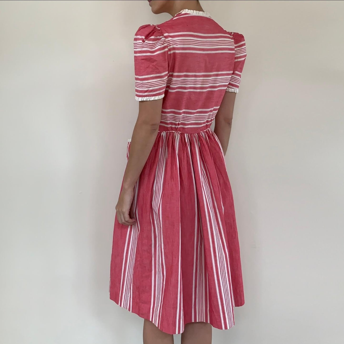 vintage pink striped dress shown from the back