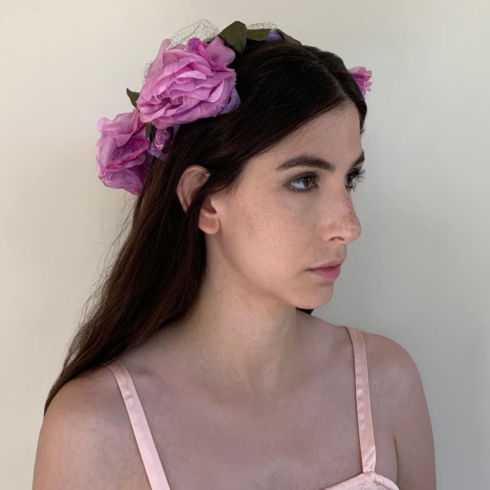 side view showing the purple peonies on the headpiece