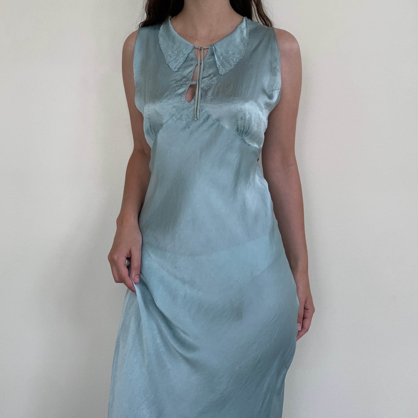1930s bias cut dress in aqua blue silk on a model