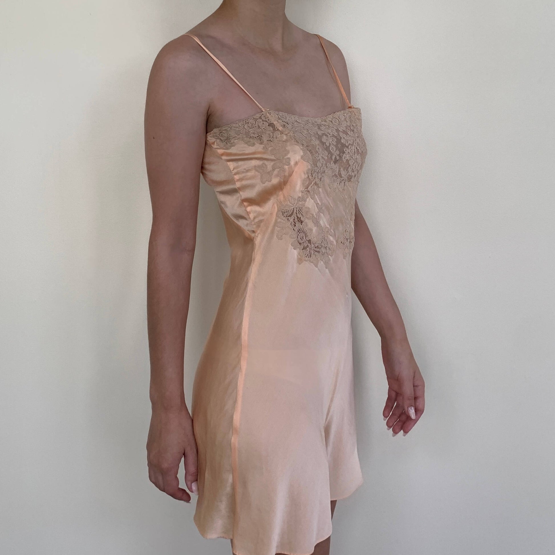 pink silk 1930s lingerie on model turned to the side