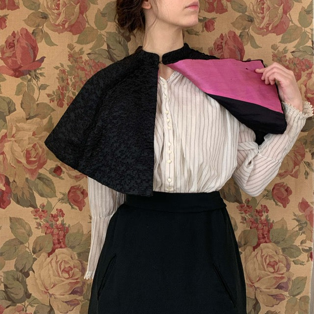 Pink lining on a black capelet from the 1890s