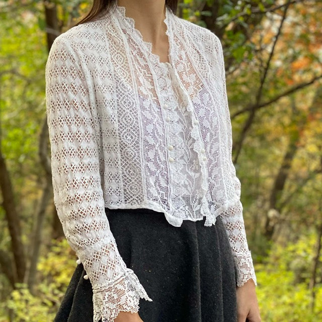 antique lace cardigan on a model outside