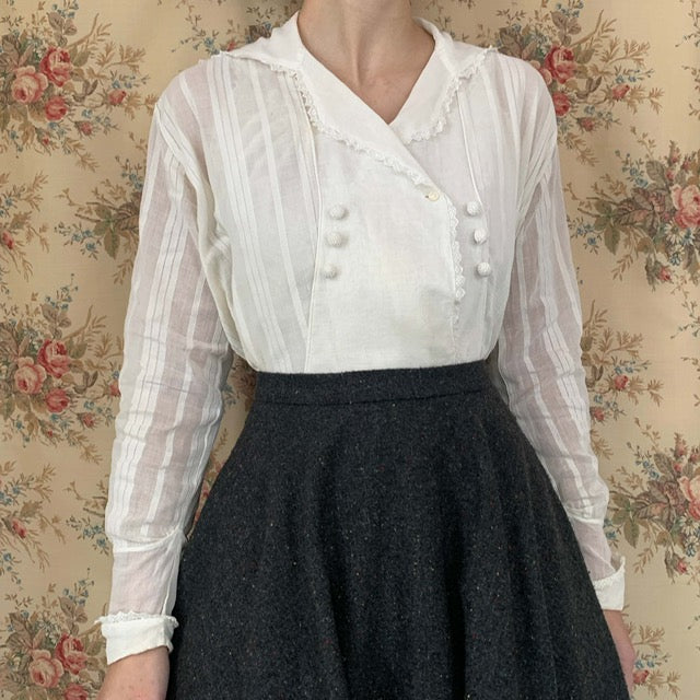 front view of the antique white blouse from the 1910s