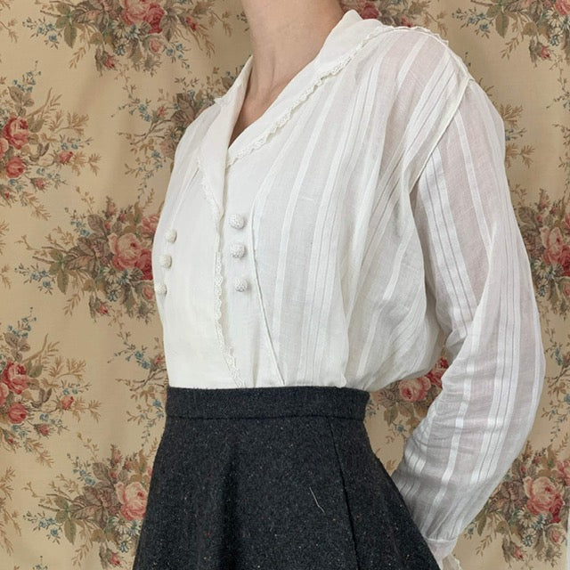 side view of the antique shirt with striped white fabric