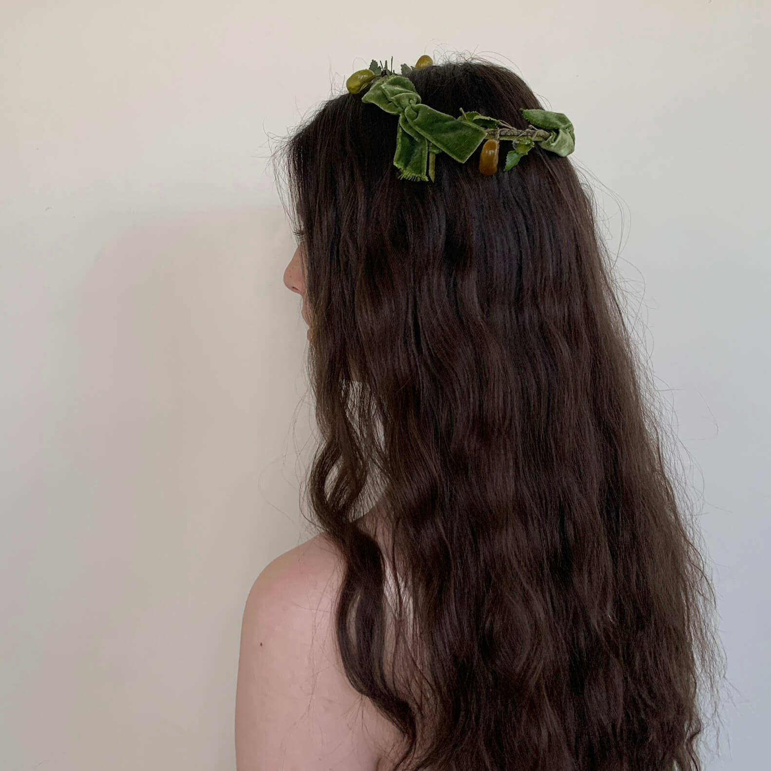 back view of the green crown showing the velvet bows